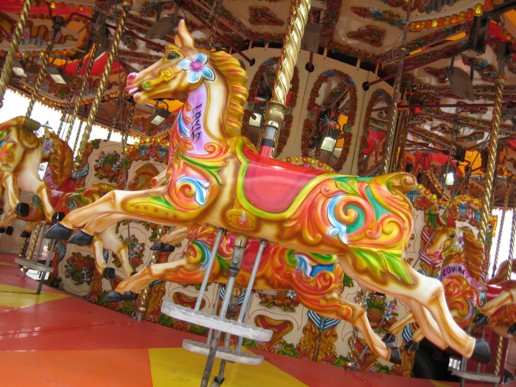 a very colourful horse on a merry-go-round