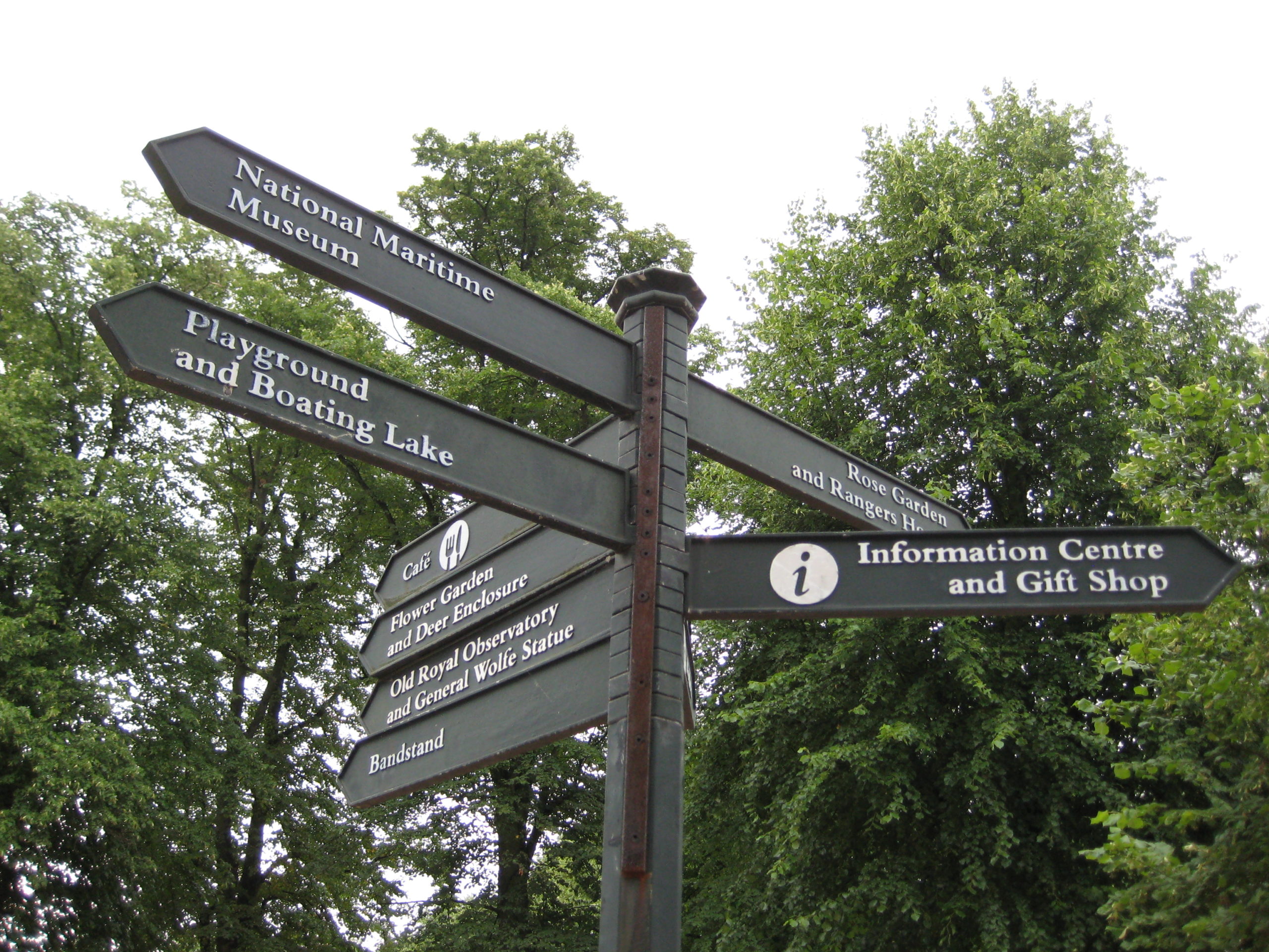 my journey: various signs on a post in a London park