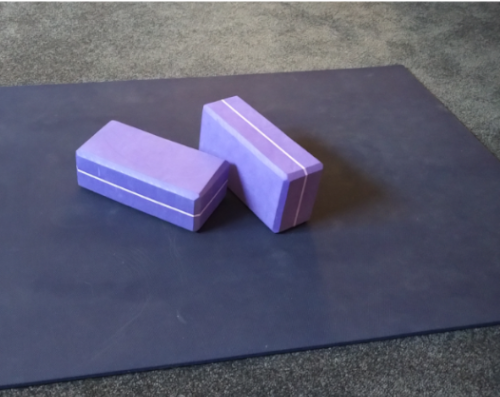 child: photo of two yoga blocks on a yoga mat