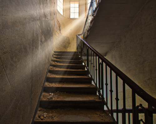 Lady: A photo of an old deserted and dusty staircase